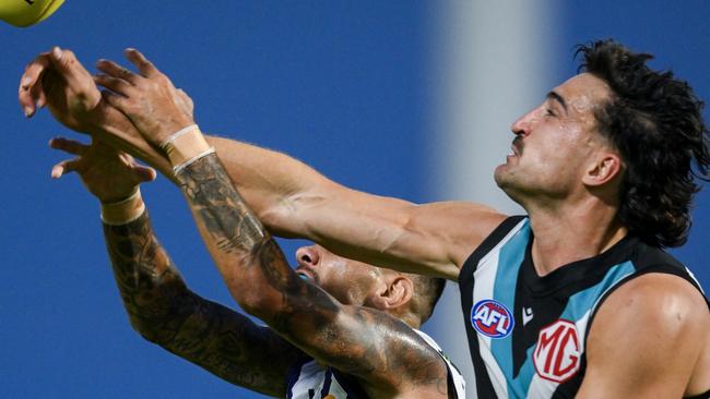 ADELAIDE, AUSTRALIA - MARCH 01: Michael Walters of the Dockers   competes for a mark against Ivan Soldo of the Power during the 2024 AFL Community Series match between Port Adelaide Power and Fremantle Dockers at Alberton Oval on March 01, 2024 in Adelaide, Australia. (Photo by Mark Brake/Getty Images)