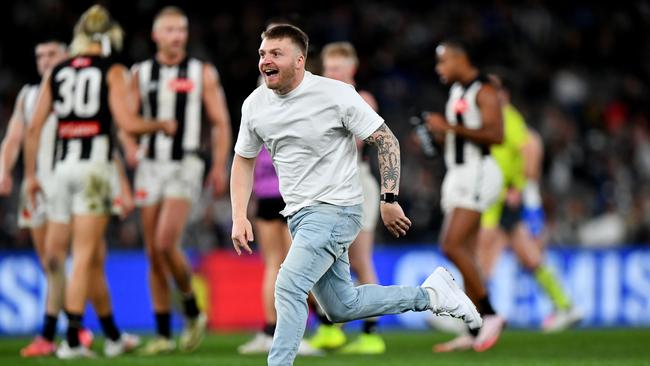 Conor Clarke runs onto the field during the match between North Melbourne and Collingwood. (Photo by Josh Chadwick/AFL Photos/Getty Images)