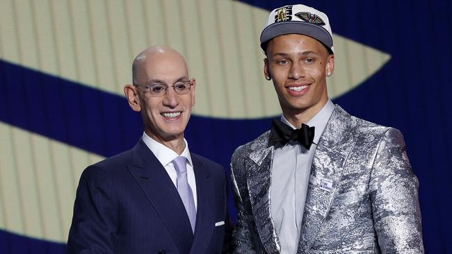 NBA commissioner Adam Silver (L) and Dyson Daniels.