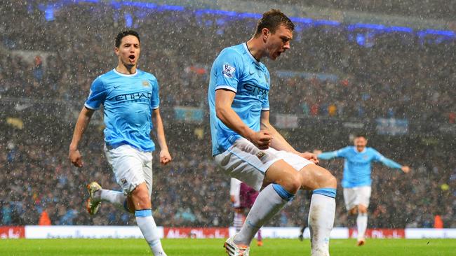 There’s relief around Etihad Stadium as Edin Dzeko celebrates.