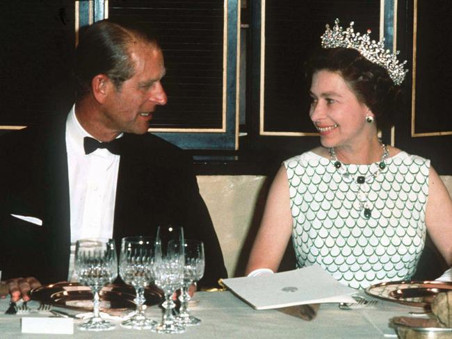 Queen Elizabeth II and Prince Philip, the Duke of Edinburgh at a State banquet in 1970. Picture: Anwar Hussein/Getty Images