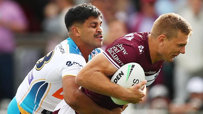 MUDGEE, AUSTRALIA - APRIL 17: Tom Trbojevic of the Sea Eagles is tackled during the round six NRL match between the Manly Sea Eagles and the Gold Coast Titans at Glen Willow Sporting Complex, on April 17, 2021, in Mudgee, Australia. (Photo by Mark Metcalfe/Getty Images)