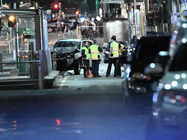 Police conduct overnight investigations after the Flinders St attack on Thursday in Melbourne.