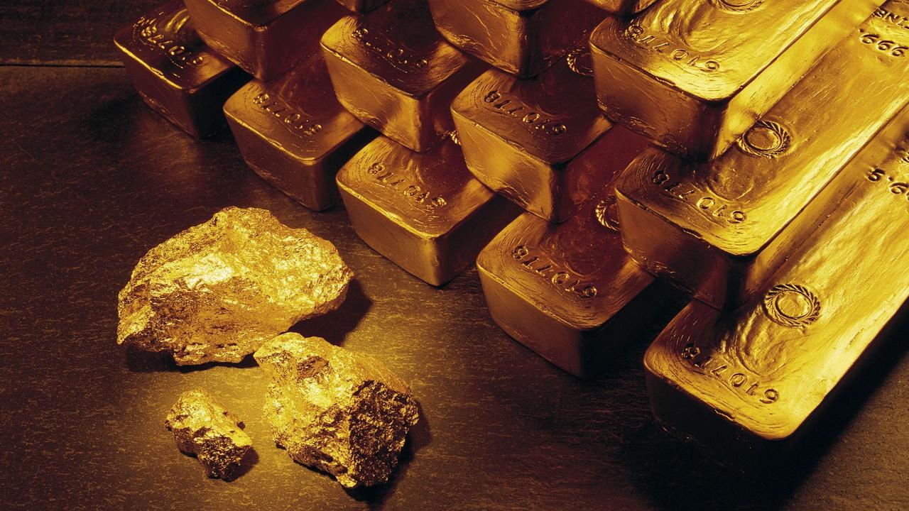Gold nuggets and ingots, which are made by melting the nuggets and pouring them into a mould.