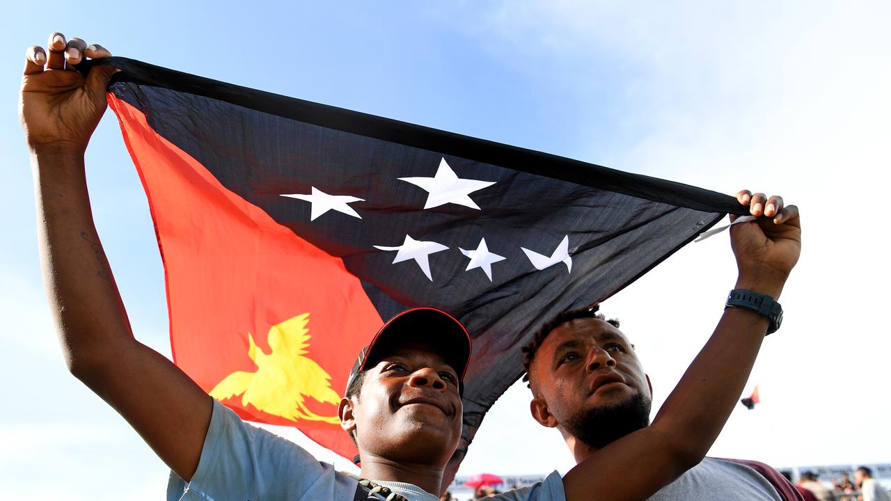 Local fans celebrate a try, during the Pool C, round 3 Rugby League World Cup match between Papua New Guinea and the USA at the Oil Research National Football stadium in Port Moresby Papua New Guinea, Sunday, November 12, 2017. (AAP Image/Joe Castro) NO ARCHIVING, EDITORIAL USE ONLY