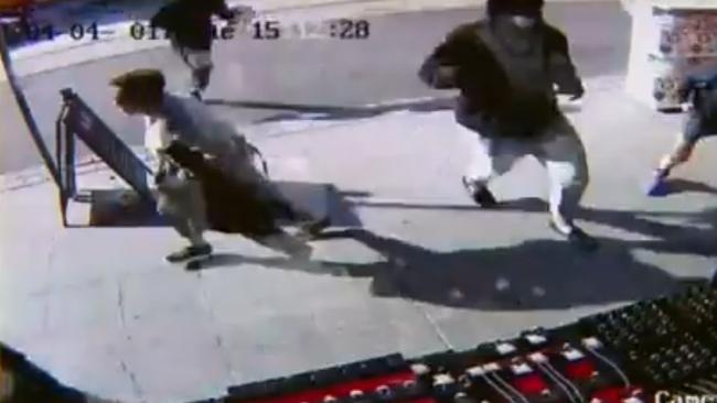 Masked robbers approach the Elsternwick jewellery. Picture: Channel 9.