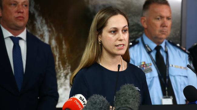 Laura Boekel, senior meteorologist with BOM, flanked by Queensland Premier Steven Miles. Picture: David Clark