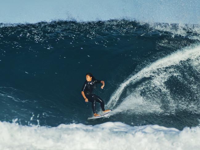 A surfer in action at Sunrise Beach as a southerly swell from an east coast low pushes big waves into south east. Queensland. Photo Lachie Millard