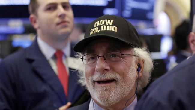 Trader Peter Tuchman wears a “Dow 23,000” hat as he works on the floor of the New York Stock Exchange. Pic: AP