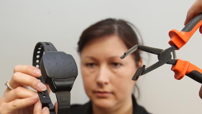 Deanne Schloss, a corrective services officer with a GPS Tracker. Pic Annette Dew