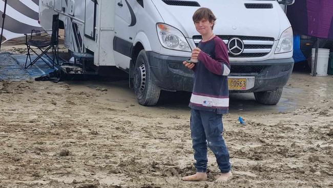 Byron Shire resident Gabrielle Euphoria’s 10-year-old son Hamish traipsing through the mud at Burning Man. The family still loved their visit.