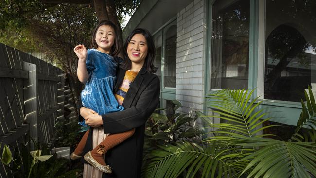 Undeterred by lockdown: Kuan Zhou and daughter Evelyn outside their home at Brunswick, in inner-city Melbourne. Daniel Pockett