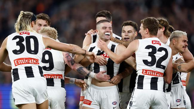 The debutant was then mobbed by his teammates. (Photo by Michael Willson/AFL Photos via Getty Images)