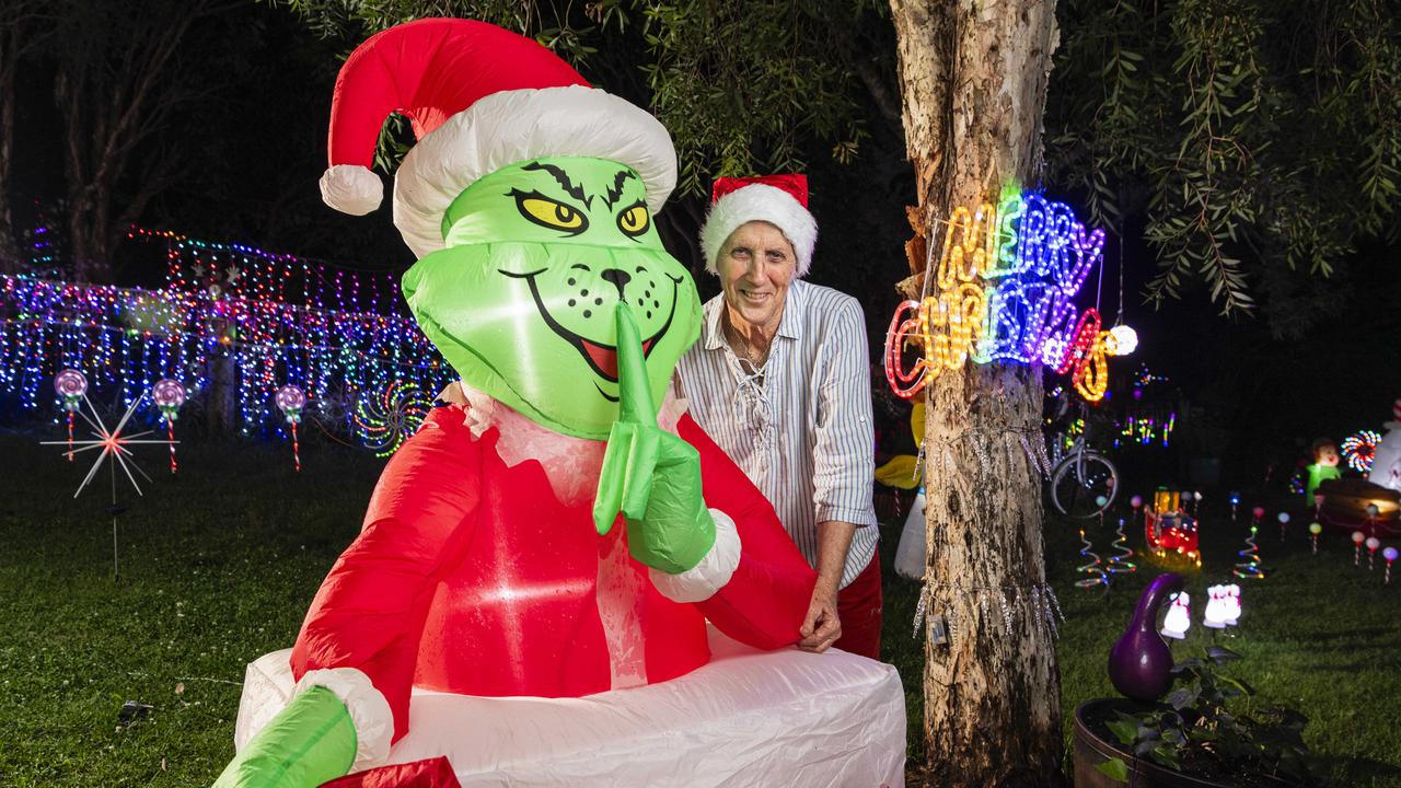 Merryl Pearce with her favorite Grinch, Christmas lights display of Des and Merryl Pearce at Grey Gums Dr, Blue Mountain Heights, Wednesday, December 11, 2024. Picture: Kevin Farmer