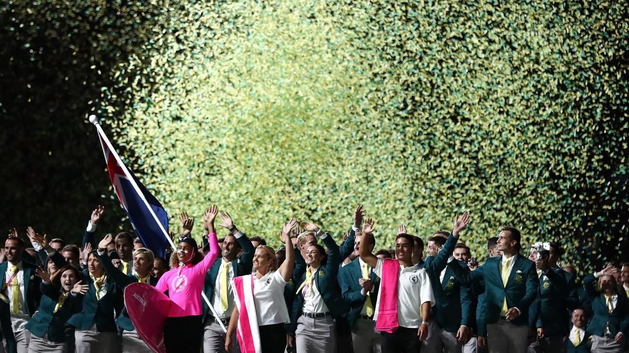 Mark Knowles, flag bearer of Australia arrives with the Australia team during the Opening Ceremony for the Gold Coast 2018 Commonwealth Games at Carrara Stadium. (Photo by Ryan Pierse/Getty Images)