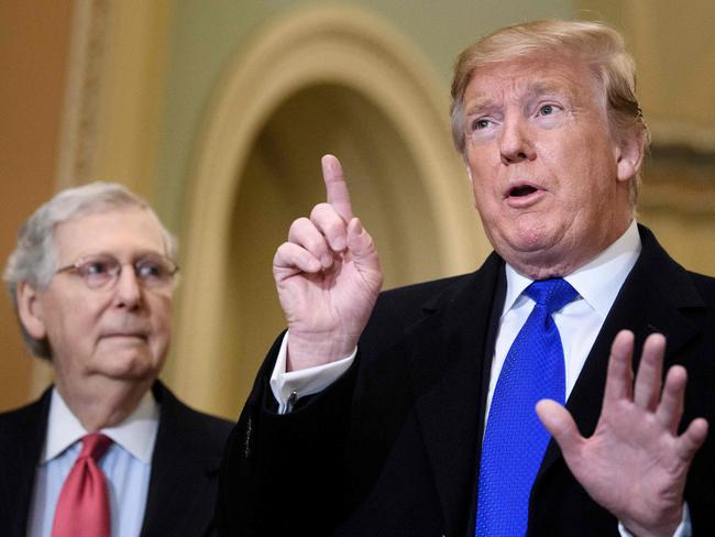 Mr Trump and senior Republican Senator, Mitch McConnell, who is considering voting against the President in his senate impeachment trial. Picture: AFP