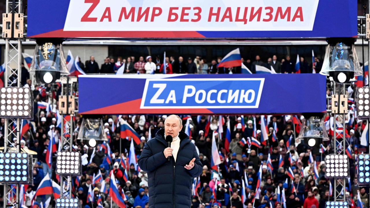 The “Z” in banners was highlighted mirroring the “z” symbol on tanks. (Photo by Sergei GUNEYEV / POOL / AFP)