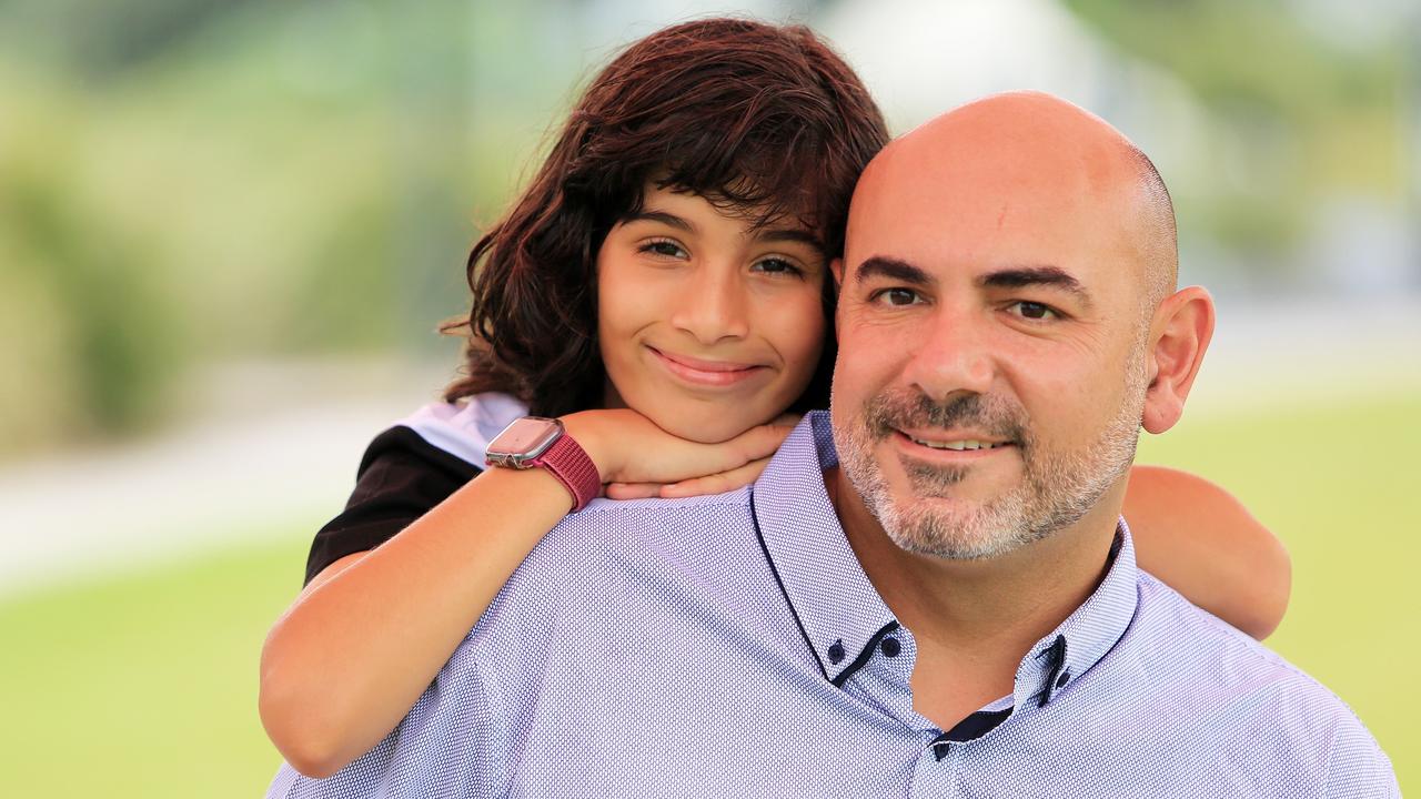 Teacher Danny Alarab takes a break with son Zane. Picture: Frank Redward