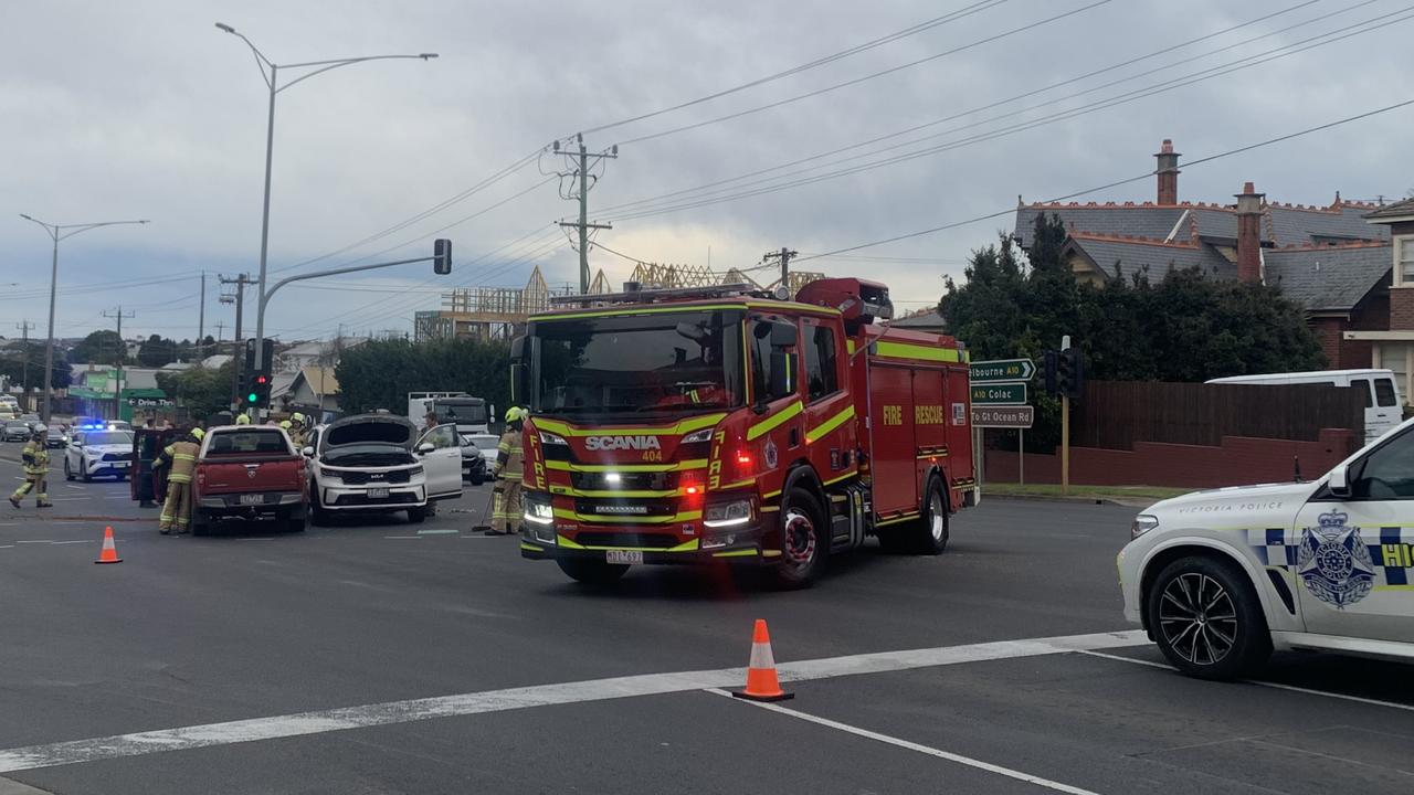 Emergency service crews respond to the collision on Latrobe Tce near the McKillop St intersection on Thursday. Picture: Lincoln Holmes.