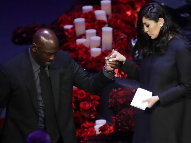 Vanessa Bryant is helped off the stage by former NBA player Michael Jordan. Picture: AP