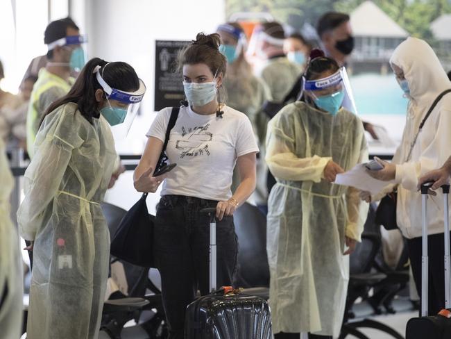 MELBOURNE, AUSTRALIA MELBOURNE, AUSTRALIA - NewsWire Photos December 20 2020: Passengers from a Sydney flight are met by DHHS staff to check permits and hand out information as they arrive at Melbourne Airport on Sunday afternoon.Picture: NCA NewsWire / David Geraghty