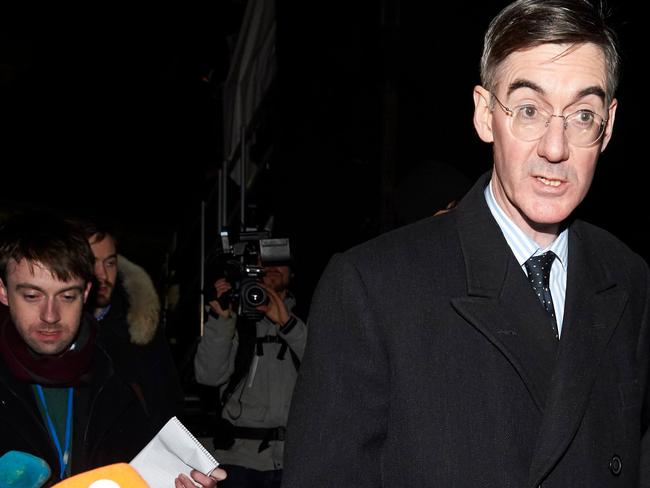 Conservative MP Jacob Rees-Mogg speaks to the media next to Parliament in central London after Britain's Prime Minister Theresa May won a confidence vote on December 12, 2018. (Photo by Niklas HALLE'N / AFP)