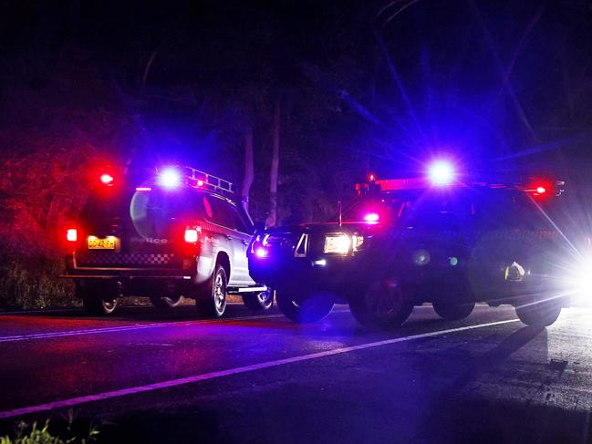 WEEKEND TELEGRAPHS - 30/3/23*** EMBARGO WARNING ***CHECK WITH PIC EDITOR TIM HUNTER BEFORE PUBLISHING - Police officers and Raptor Squad members raid a house in Ourimbah on the Central Coast and take a male into custody. NO BYLINE Picture: Sam Ruttyn NO BYLINE