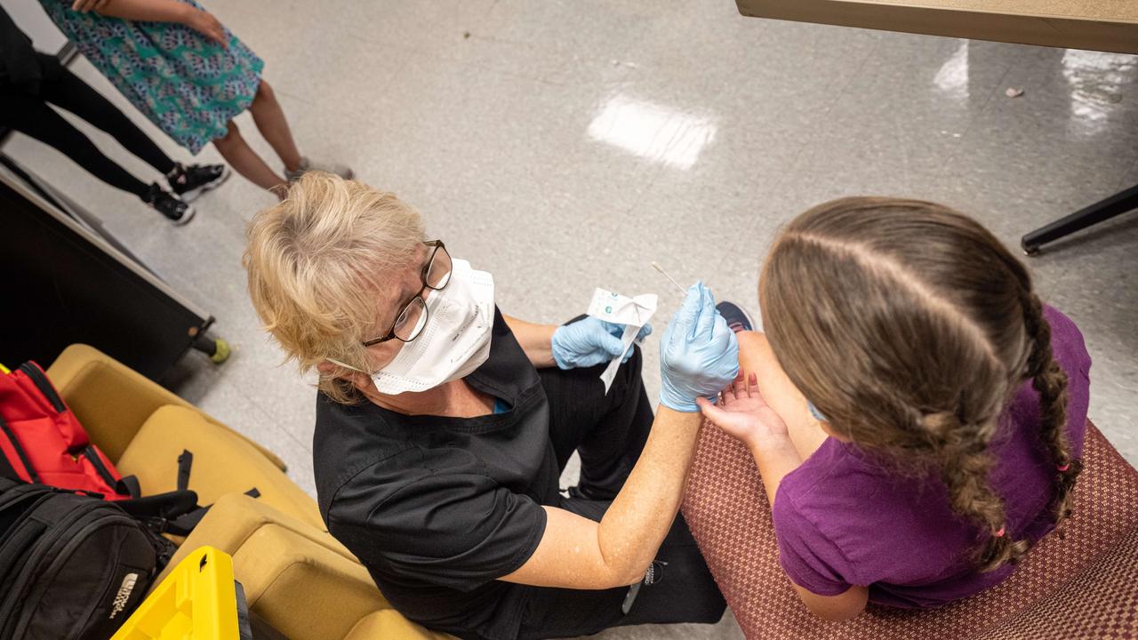 Young student is administered a test by a nurse during a Covid-19 testing day in Louisville, Kentucky. Picture: Jon Cherry/Getty Images