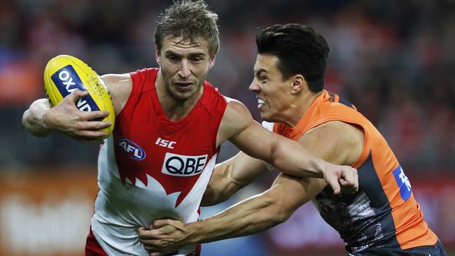 Sydney's Kieren Jack tackled by Giants Dylan Shiel during AFL match GWS Giants v Sydney Swans at Spotless Stadium. Picture. Phil Hillyard