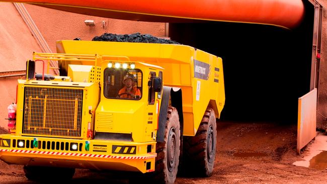 The first truck load of ore is hauled from the Lady Loretta mine north of Mount Isa