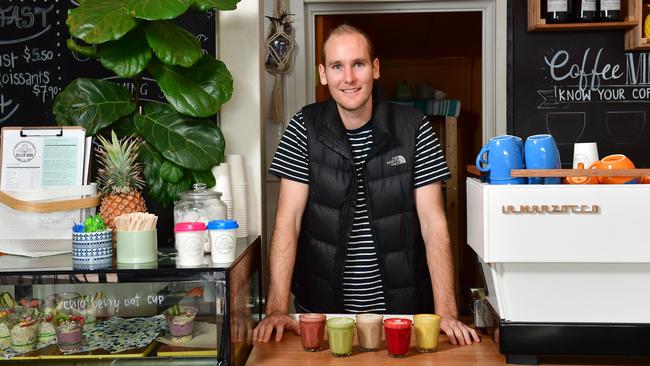 The Seller Door owner, Tom Rodger with a range of alternate lattes including beetroot cacao, golden tumeric and red velvet. Picture: AAP/Keryn Stevens