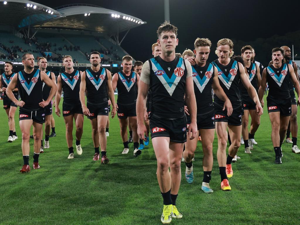 Zak Butters leads a defeated Port Adelaide off the park. Picture: Getty Images