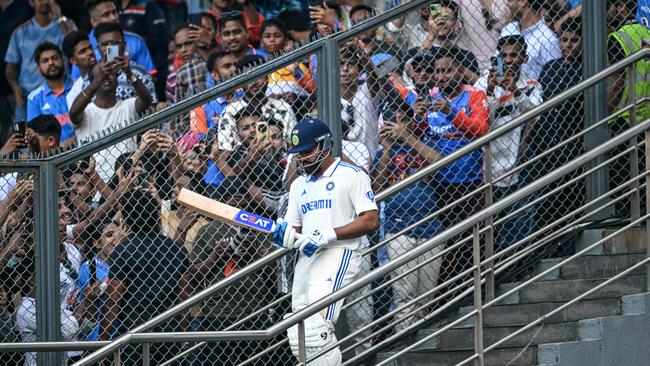 Rohit Sharma walks out to bat during the third Test against New Zealand at the Wankhede Stadium in Mumbai. Photo: AFP