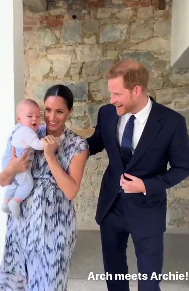 Archie Harrison Mountbatten-Windsor with parents. The pair posted a video of their meeting Archbishop Desmond Tutu on Instagram. Picture: Instagram