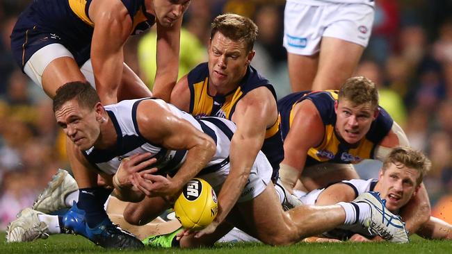 Sam Mitchell tackles Joel Selwood, who was well held by the Eagles. Picture: Getty Images