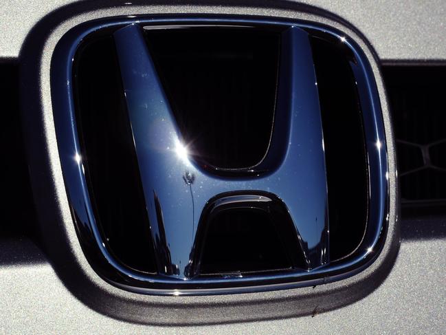 (FILES)Honda Motors logo is seen in the grill of a vehicle at a dealership in Manassas, Virginia on April 12, 2009. Honda on August 9, 2010 announced the recall of 383,000 vehicles in the United States because of problems with the ignition which could allow drivers to remove their key when the vehicle is not in the park position. Honda said some ignition locking devices became damaged or worn over time, allowing the key to be removed when the transmission is not in park. If that occurs, the vehicle could roll away and cause an accident, Honda said. AFP PHOTO/Karen BLEIER