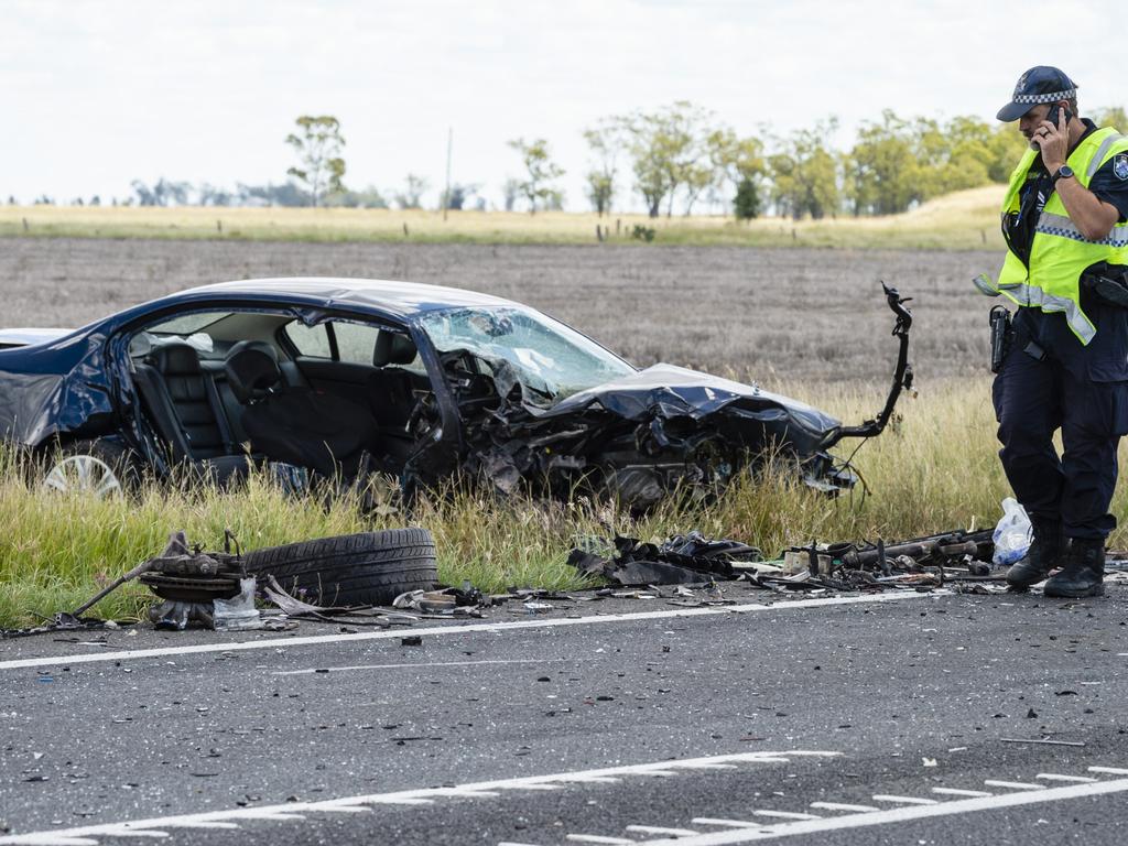 Emergency services at the scene of a fatal crash involving a truck and a car on the Warrego Hwy near Bowenville, Monday, February 7, 2022. Picture: Kevin Farmer