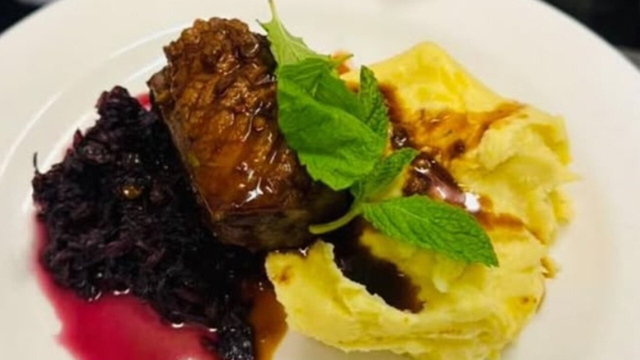 The house dry aged lamb back strap, with braised radicchio, mint, raisins, pommes puree at Restaurant 1889.