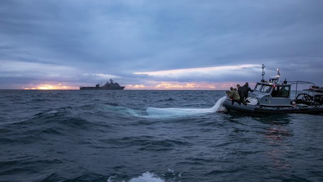 US Navy Sailors assigned to Explosive Ordnance Disposal Group 2 recover a high-altitude surveillance balloon off the coast of Myrtle Beach, South Carolina. Picture: Supplied