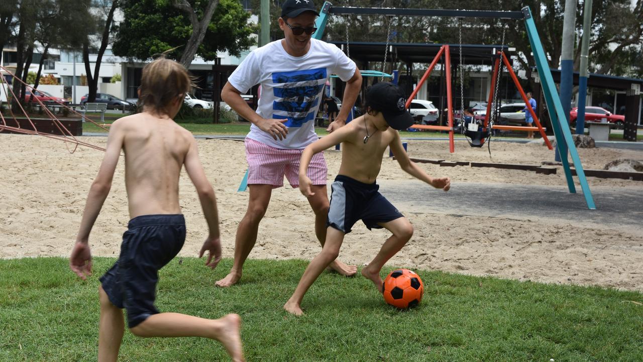 Benjamin Hampe with Levi and Archie Blattman in Cotton Tree Park, Maroochydore for Boxing Day. Picture: Sam Turner