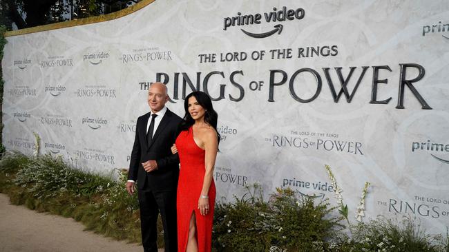 Amazon founder and executive chair Jeff Bezos and Lauren Sanchez pose on the red carpet upon arrival to attend the Global Premiere of "The Lord of the Rings: The Rings of Power" at the Odeon cinema in Leicester Square, central London. "The Lord of the Rings: The Rings of Power," based on the works of J.R.R. Tolkien, had marked the biggest premiere in the history of Prime Video -- with 25 million viewers. (Photo by Niklas HALLE'N / AFP)