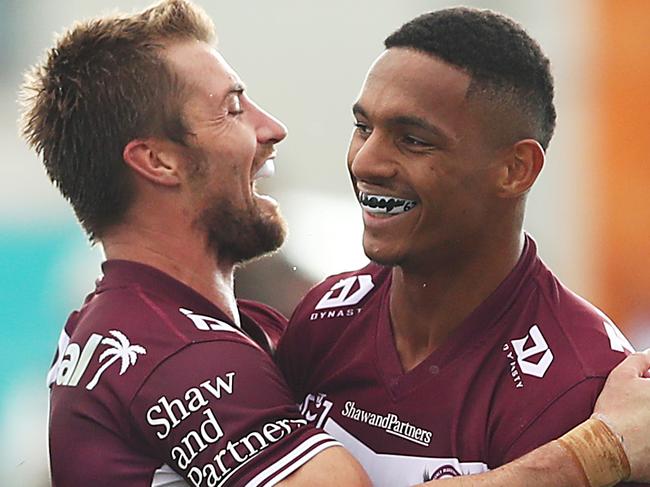 MUDGEE, AUSTRALIA - APRIL 17: Jason Saab of the Sea Eagles celebrates scoring a try with team mate Kieran Foran of the Sea Eagles during the round six NRL match between the Manly Sea Eagles and the Gold Coast Titans at Glen Willow Sporting Complex, on April 17, 2021, in Mudgee, Australia. (Photo by Mark Metcalfe/Getty Images)