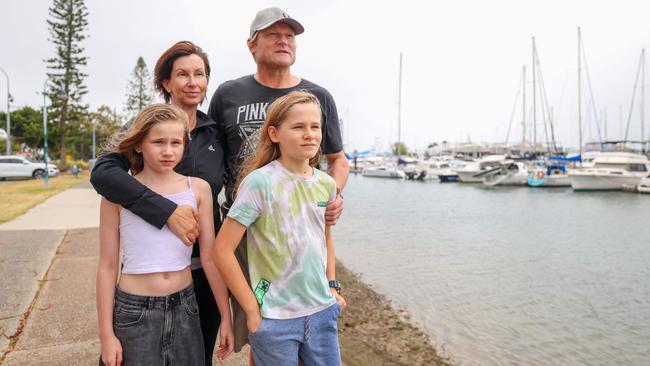 On Brisbane’s southeast coast, Fiona and Mark Lindberg and Aiden and Abbie walk along the Manly esplanade. Picture: Peter Wallis