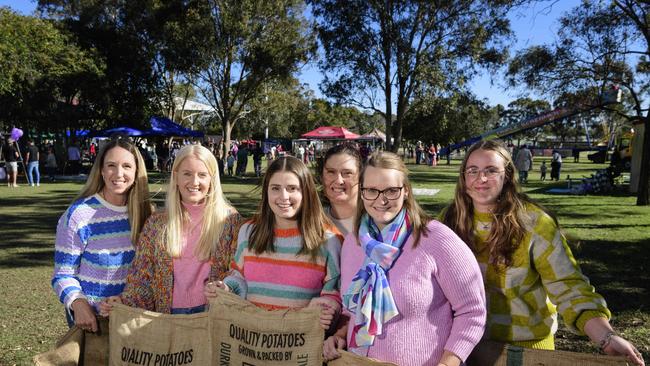 Ready to help out with the sack races are (from left) Amee Leonardi, Sam Pringle, Kristie Cosmo, Erin Dwyer, Renee Smith and Ashleigh Ciesiolka at Sadie's Day Out, a special community event to celebrate the life of five-year-old crash victim Sadie, held at Cambooya State School, Saturday, June 7, 2025. Picture: Kevin Farmer
