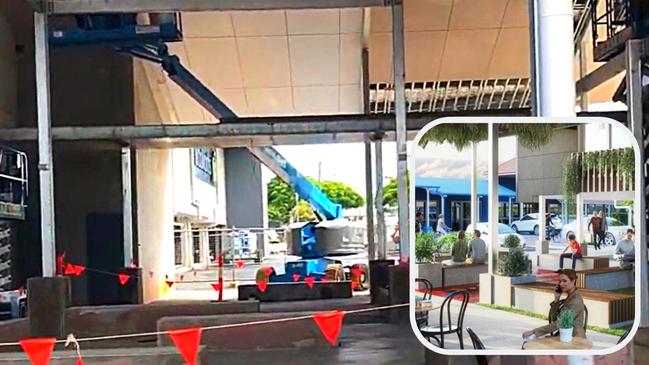 Workers put the finishing touches on a massive atrium which will become an outdoor eatery and cafe area in front of the new Woolworths at Redland Bay.