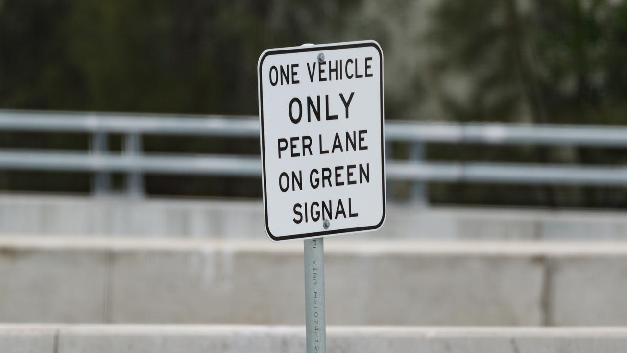 Traffic at the east-bound merge of the Rozelle Interchange was heavy. Picture shows signage at the single car traffic light which is causing lots of frustration for motorists. Picture: Max Mason-Hubers