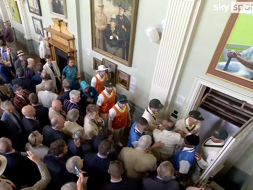 Usman Khawaja and Dave Warner in dispute with several MCC Members in the Long Room at Lords during the lunch break.