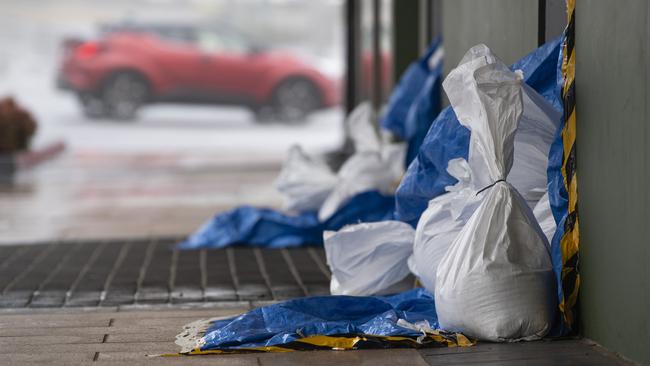 Businesses in Russell St sandbag in preparation for rising creek levels as the aftermath of TC Alfred impacts Toowoomba, Sunday, March 9, 2025. Picture: Kevin Farmer