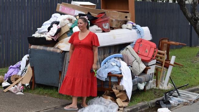 Dawn Kapernick with wrecked items from Merissa's house in Pimlico. Picture: Nikita McGuire