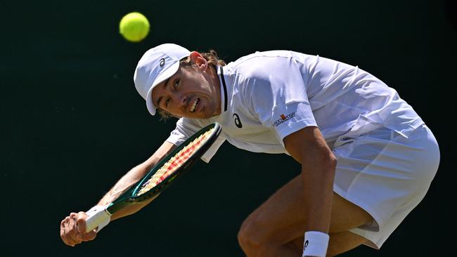 Alex De Minaur goes about his business in a uniquely Australian way. Picture: Glyn Kirk/AFP